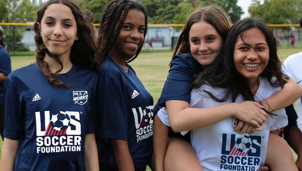 image of girls on soccer field