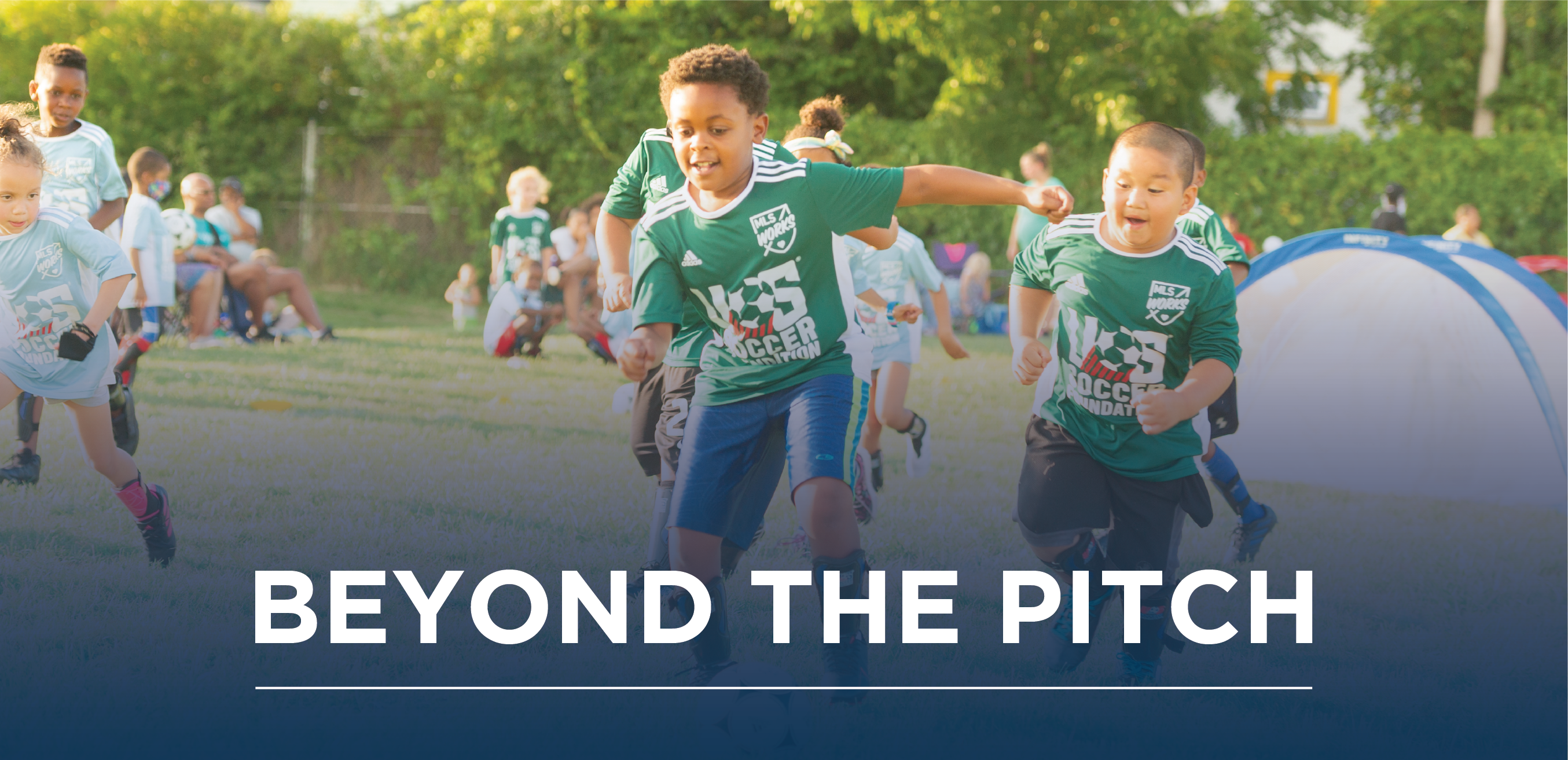 beyond the pitch newsletter hero image with children in green soccer jerseys running after soccer ball