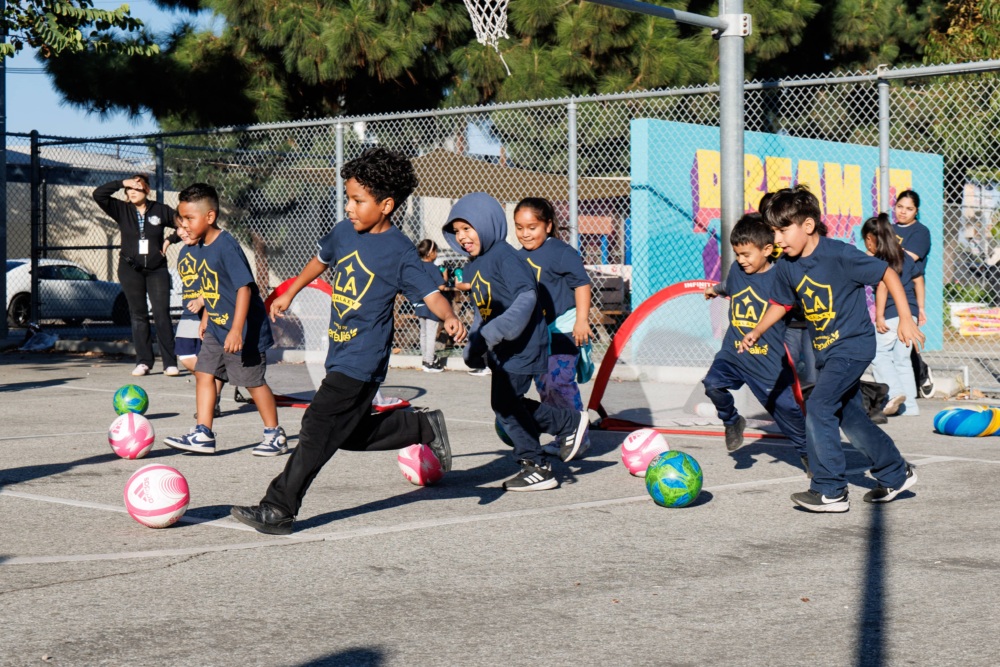 Kids playing pickup games of soccer