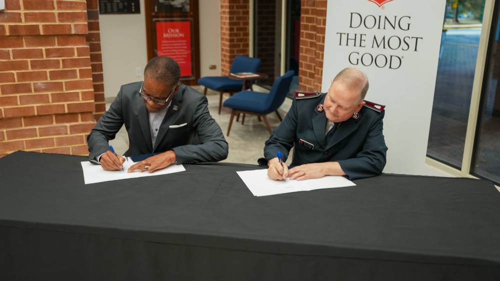 Leaders of the U.S. Soccer Foundation and The Salvation Army sign memorandum of understanding