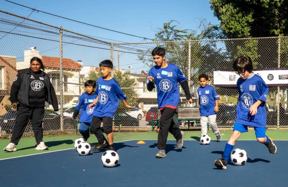 Kids playing on new mini-pitch at Crocker Amazon Playground