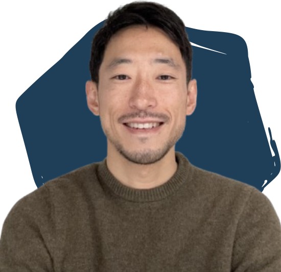 Alex Bonk in front of a blue hexagon