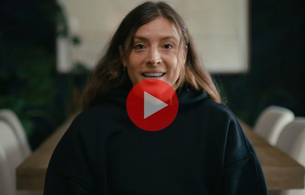 Sofia Huerta looking at the camera. The play button at the center indicates a video.