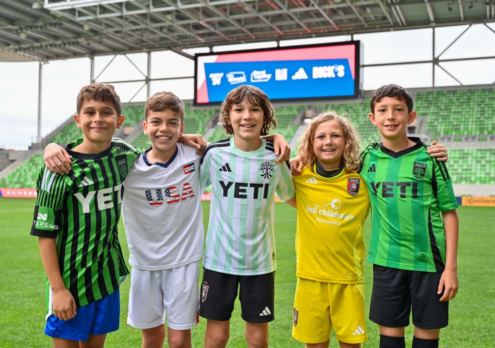 Kids sand together at 2026 SXSW community event.